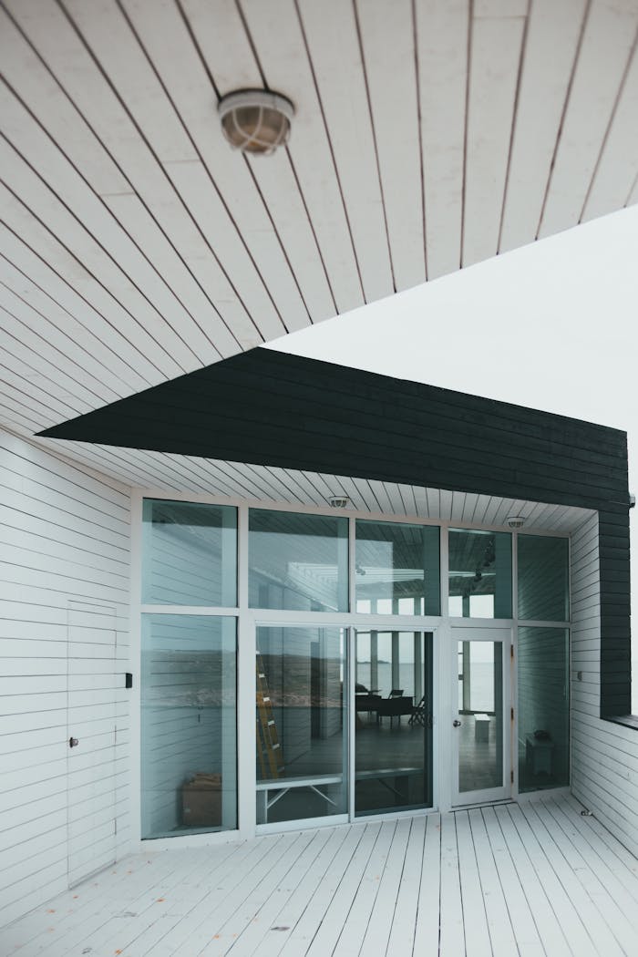 services-05 Elegant modern architectural design showcasing a glass facade entrance.
